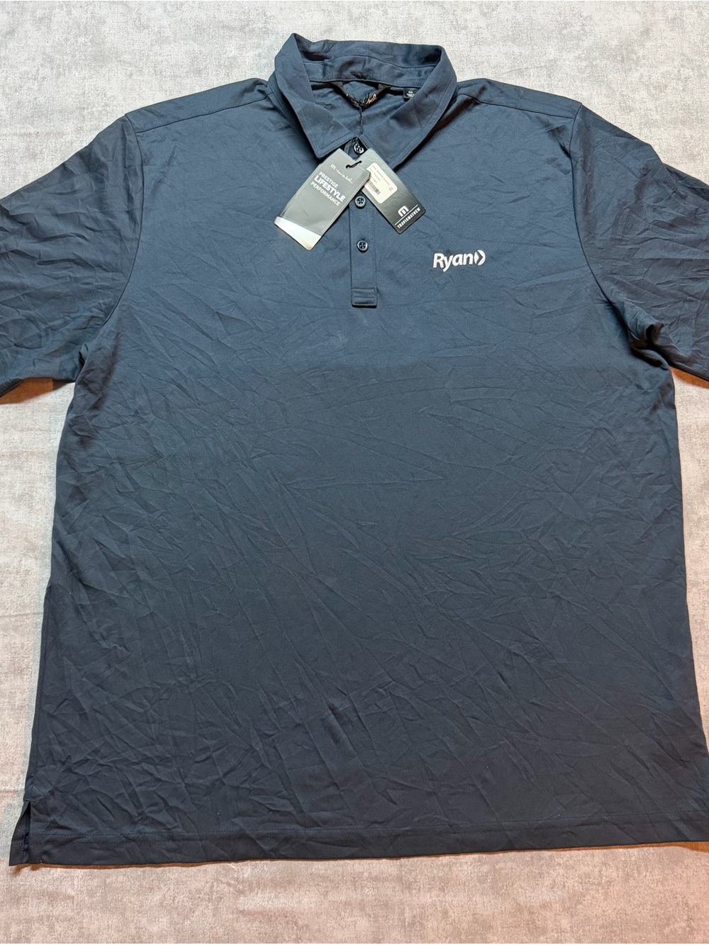 Travis Mathew Navy Blue Polo with Ryan Logo